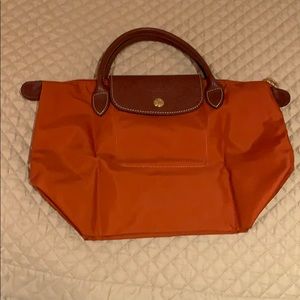 Orange Longchamp short handled small purse